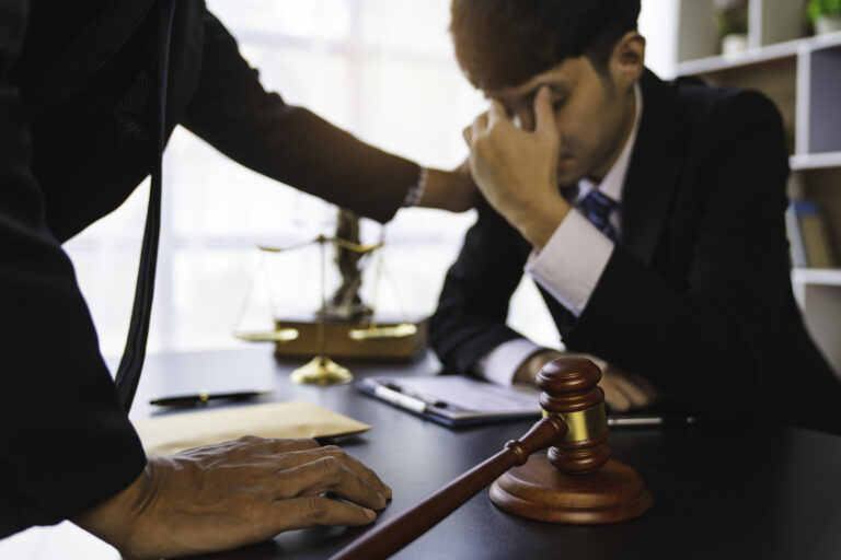 A lawyer or judge is encouraging. In a client's courtroom at a lawyer's office, litigation consultation concept with lawyers.