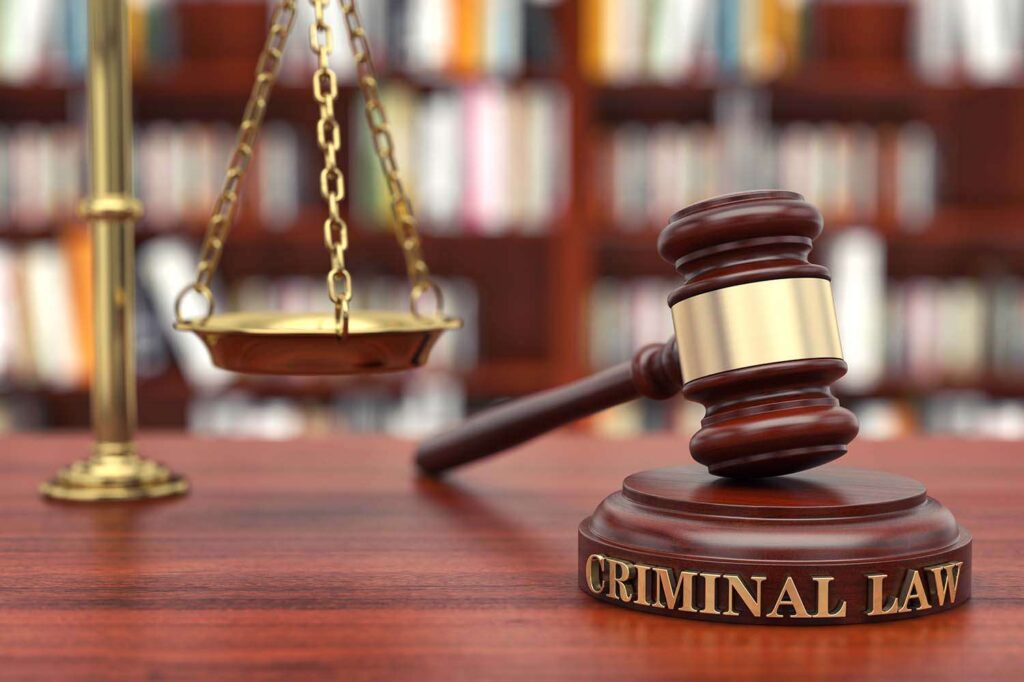 Judge gavel and scales of justice in courtroom