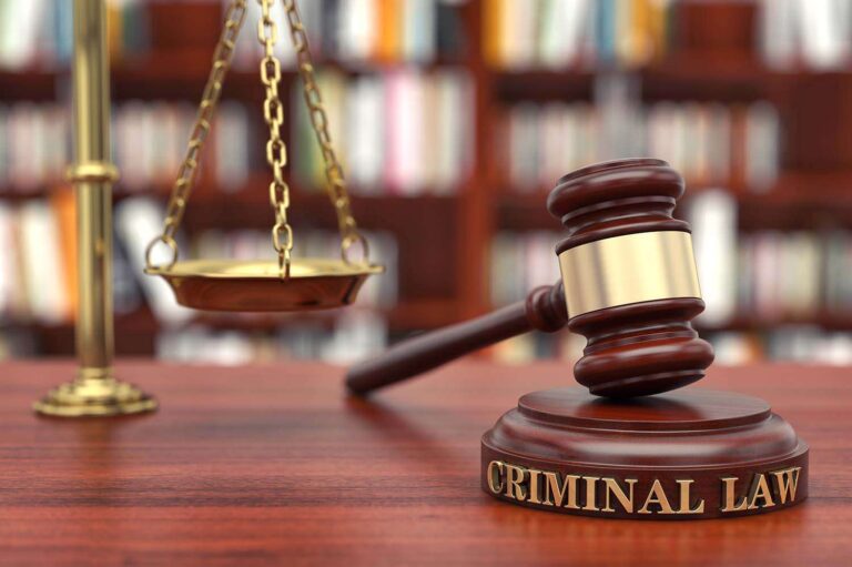 Judge gavel and scales of justice in courtroom