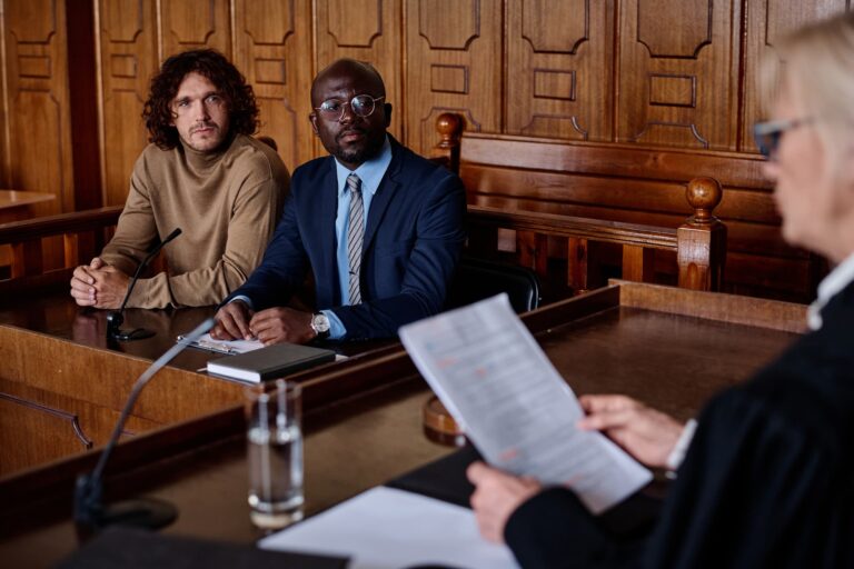 Lawyer and client in Arizona courtroom discussing set aside conviction
